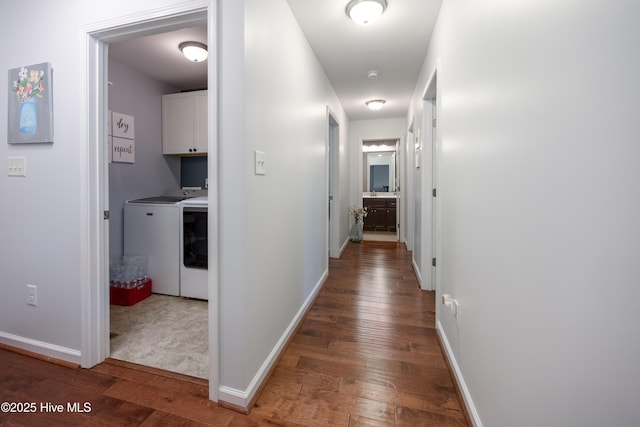 104 Northgate Ln, Clinton, NC 28328 - hallway featuring independent washer and dryer, wood-type flooring, and baseboards