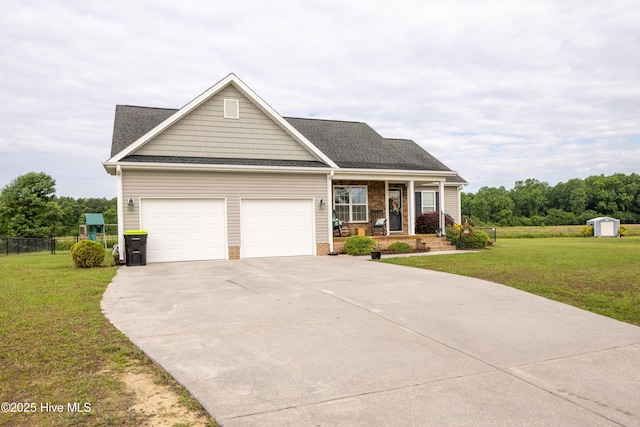 104 Northgate Ln, Clinton, NC 28328 - view of front of house featuring covered porch, an attached garage, concrete driveway, and a shingled roof