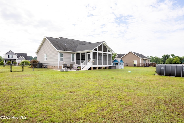 104 Northgate Ln, Clinton, NC 28328 - rear view of property featuring a sunroom, a patio area, a shingled roof, and central AC unit