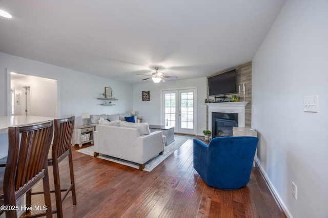104 Northgate Ln, Clinton, NC 28328 - living area featuring ceiling fan, dark wood finished floors, and a glass covered fireplace