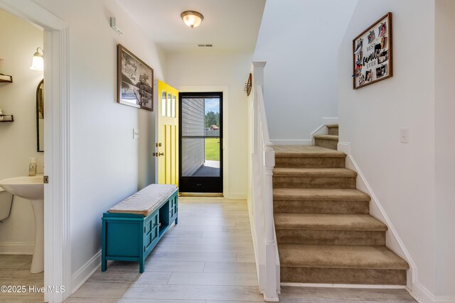 403 Stanford Ct, Maysville, NC 28555 - stairway featuring wood finished floors and baseboards