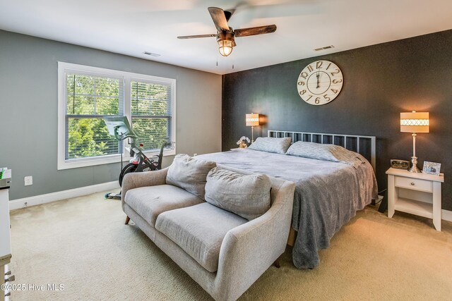 403 Stanford Ct, Maysville, NC 28555 - carpeted bedroom featuring baseboards, ceiling fan, and an accent wall