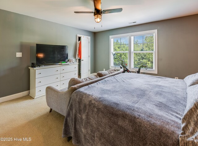 403 Stanford Ct, Maysville, NC 28555 - bedroom featuring light colored carpet, baseboards, and a ceiling fan