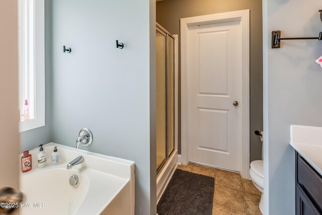 403 Stanford Ct, Maysville, NC 28555 - bathroom featuring toilet, vanity, a stall shower, a bath, and tile patterned floors