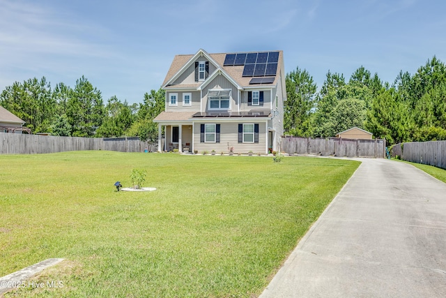 403 Stanford Ct, Maysville, NC 28555 - view of front of house with roof mounted solar panels, roof with shingles, and concrete driveway