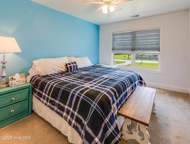 403 Stanford Ct, Maysville, NC 28555 - bedroom with light carpet, baseboards, and a ceiling fan