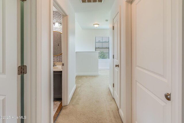 403 Stanford Ct, Maysville, NC 28555 - corridor with light carpet and baseboards
