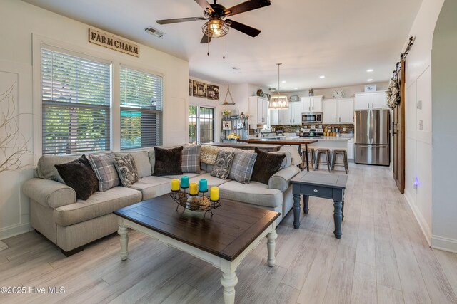 403 Stanford Ct, Maysville, NC 28555 - living room featuring a ceiling fan, light wood finished floors, baseboards, and recessed lighting