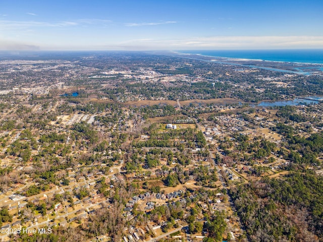 aerial view of property's location featuring a nearby body of water