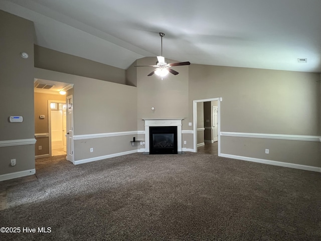 unfurnished living room with ceiling fan, carpet floors, a fireplace with flush hearth, lofted ceiling, and baseboards