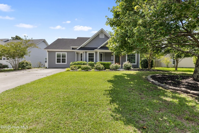 view of front of house featuring a front yard and driveway