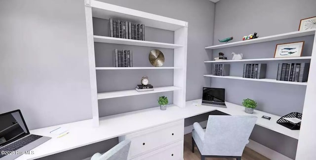 2112 Arnold Palmer Dr, Shallotte, NC 28470 - home office with built in study area, built in features, and wood finished floors