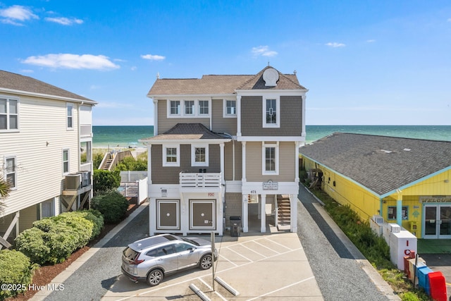 2112 Arnold Palmer Dr, Shallotte, NC 28470 - view of front of property featuring stairway, a water view, and uncovered parking