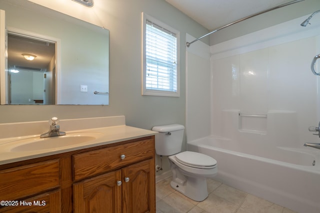 full bathroom with toilet, tile patterned floors, vanity, shower / bathtub combination, and baseboards
