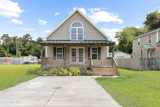 149 Lee St, Holly Ridge, NC 28445 - view of front facade with a porch, a standing seam roof, and metal roof
