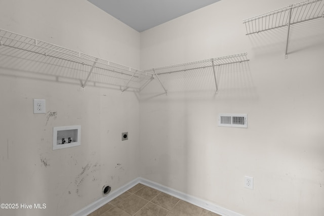 149 Lee St, Holly Ridge, NC 28445 - laundry area featuring hookup for an electric dryer, hookup for a washing machine, baseboards, and tile patterned flooring