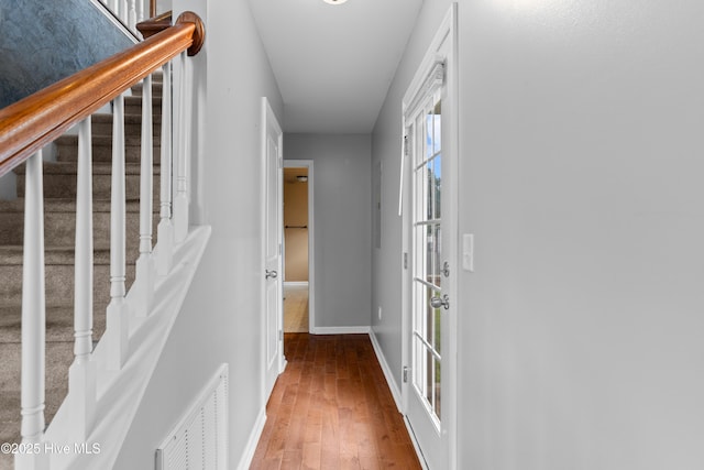 149 Lee St, Holly Ridge, NC 28445 - corridor featuring baseboards, hardwood / wood-style floors, and stairway