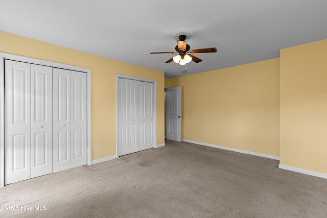 149 Lee St, Holly Ridge, NC 28445 - unfurnished bedroom featuring multiple closets, carpet flooring, baseboards, and ceiling fan