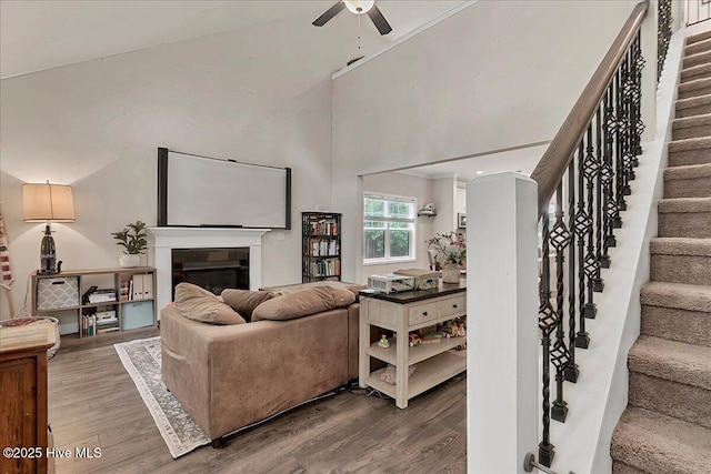 11 Bedford Cir, Pinehurst, NC 28374 - living area featuring wood finished floors, ceiling fan, stairs, and a fireplace
