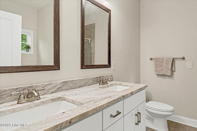 11 Bedford Cir, Pinehurst, NC 28374 - full bath with toilet, double vanity, and baseboards