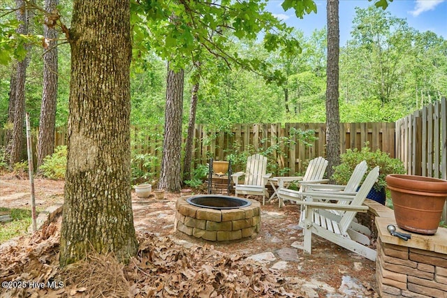 11 Bedford Cir, Pinehurst, NC 28374 - view of patio / terrace featuring an outdoor fire pit and fence