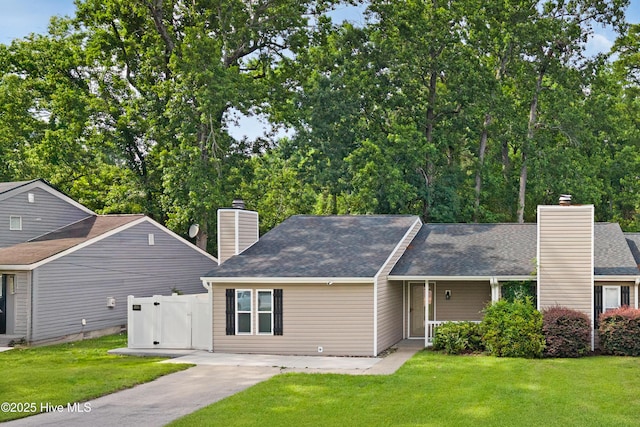 2414 Educational Dr, New Bern, NC 28562 - view of front of house with a chimney and a shingled roof