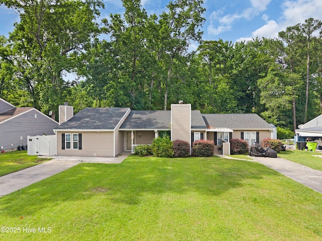 2414 Educational Dr, New Bern, NC 28562 - view of front of house with a chimney and driveway