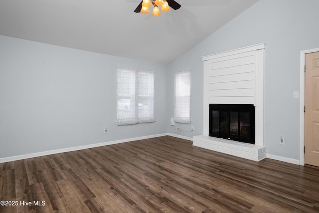 2414 Educational Dr, New Bern, NC 28562 - unfurnished living room with a ceiling fan, dark wood-type flooring, a brick fireplace, high vaulted ceiling, and baseboards