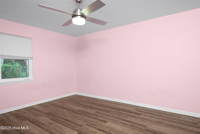 2414 Educational Dr, New Bern, NC 28562 - unfurnished room featuring dark wood-type flooring, baseboards, and a ceiling fan