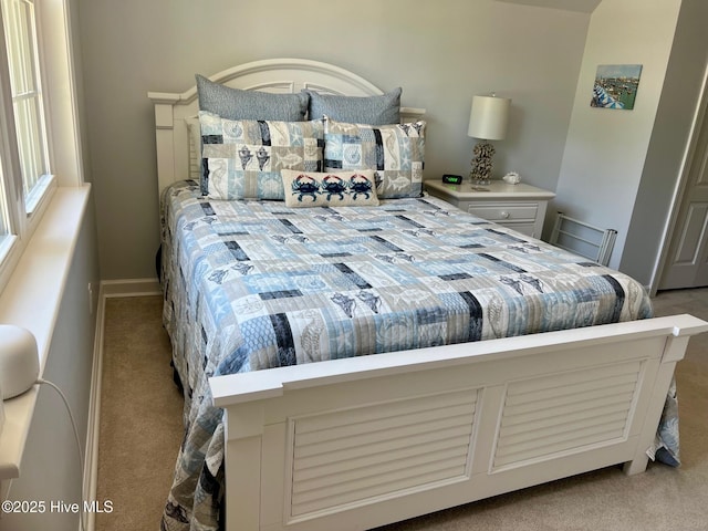 carpeted bedroom with baseboards