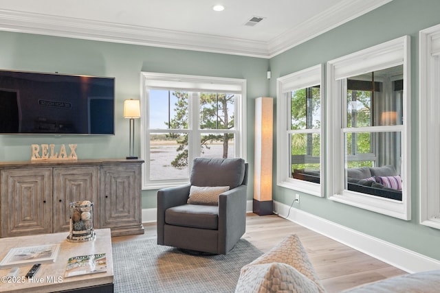 114 Lucas Cv, Oak Island, NC 28465 - living area with wood finished floors, ornamental molding, baseboards, and recessed lighting