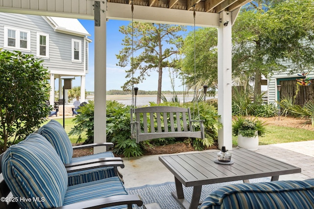 114 Lucas Cv, Oak Island, NC 28465 - view of patio with a water view