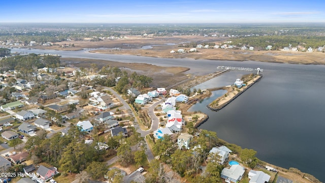 114 Lucas Cv, Oak Island, NC 28465 - aerial view of property and surrounding area featuring a large body of water and nearby suburban area