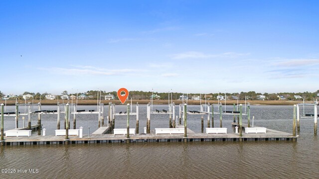 114 Lucas Cv, Oak Island, NC 28465 - dock area featuring boat lift and a water view