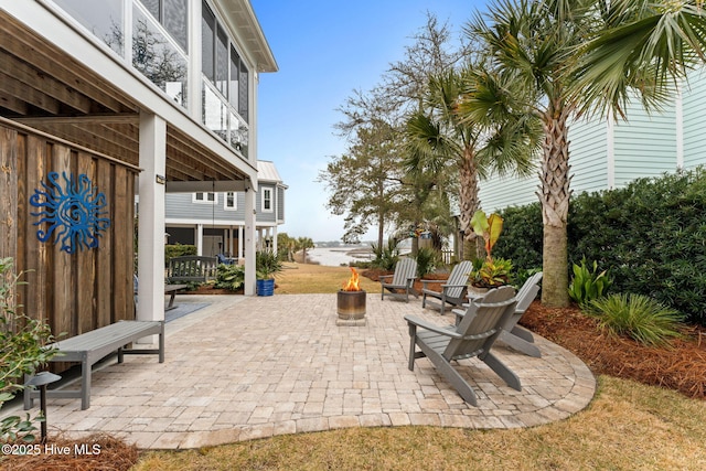 114 Lucas Cv, Oak Island, NC 28465 - view of patio featuring a fire pit