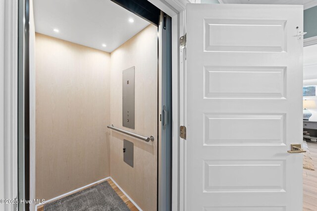 114 Lucas Cv, Oak Island, NC 28465 - elevator featuring wood finished floors
