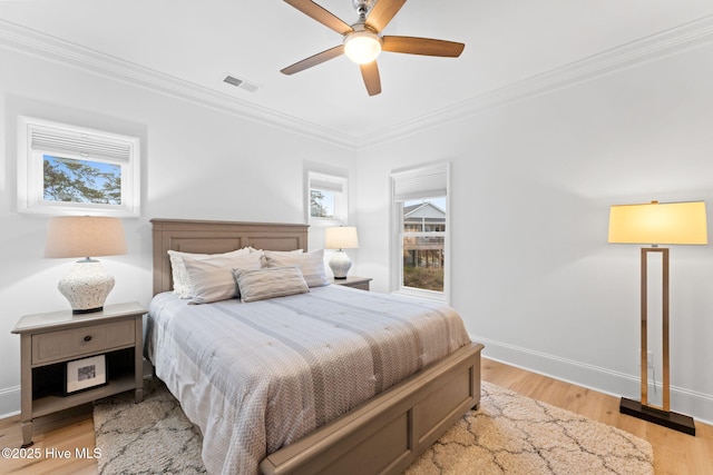 114 Lucas Cv, Oak Island, NC 28465 - bedroom featuring ornamental molding, light wood finished floors, baseboards, and ceiling fan