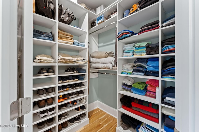 114 Lucas Cv, Oak Island, NC 28465 - walk in closet featuring wood finished floors