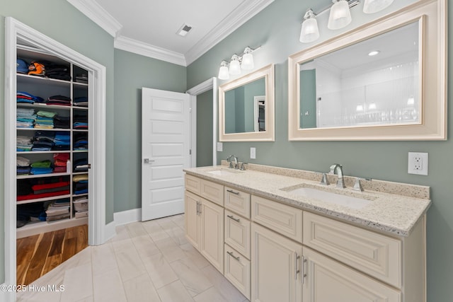114 Lucas Cv, Oak Island, NC 28465 - bathroom featuring double vanity, crown molding, and a spacious closet