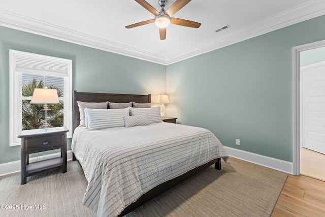 114 Lucas Cv, Oak Island, NC 28465 - bedroom featuring ornamental molding, baseboards, wood finished floors, and ceiling fan
