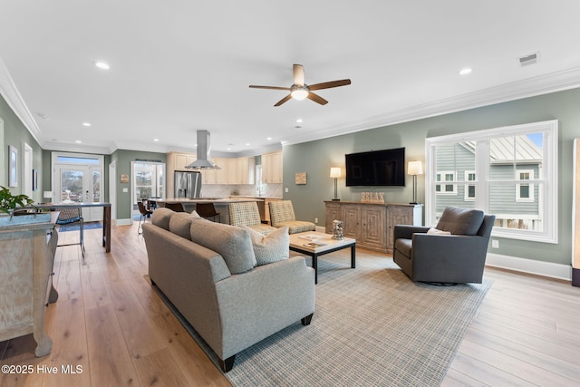 114 Lucas Cv, Oak Island, NC 28465 - living area with crown molding, ceiling fan, recessed lighting, light wood-style floors, and baseboards