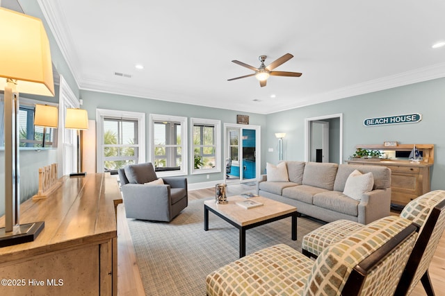 114 Lucas Cv, Oak Island, NC 28465 - living room featuring light wood-style floors, a ceiling fan, crown molding, and recessed lighting