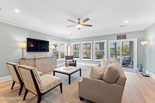 114 Lucas Cv, Oak Island, NC 28465 - living room featuring baseboards, ceiling fan, light wood-type flooring, ornamental molding, and recessed lighting