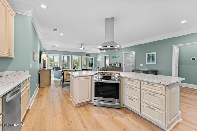 114 Lucas Cv, Oak Island, NC 28465 - kitchen with stainless steel appliances, open floor plan, exhaust hood, ornamental molding, and recessed lighting