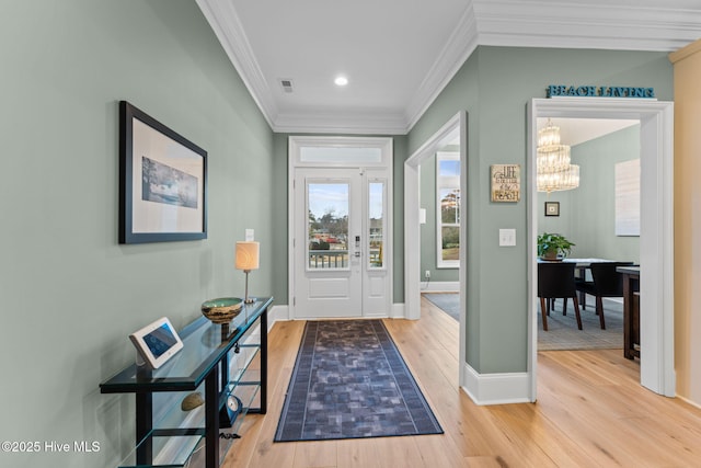 114 Lucas Cv, Oak Island, NC 28465 - foyer with ornamental molding, light wood-type flooring, a chandelier, baseboards, and recessed lighting