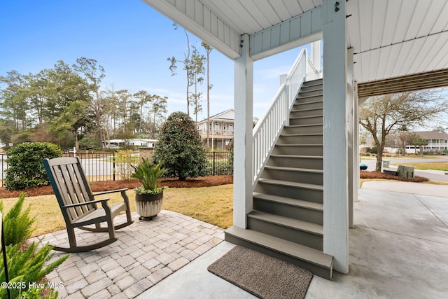 114 Lucas Cv, Oak Island, NC 28465 - view of patio / terrace featuring stairway