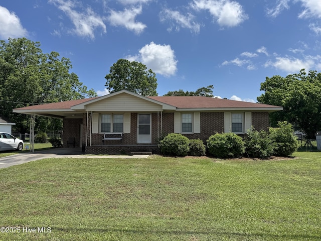 ranch-style house with concrete driveway, brick siding, a carport, and a front yard