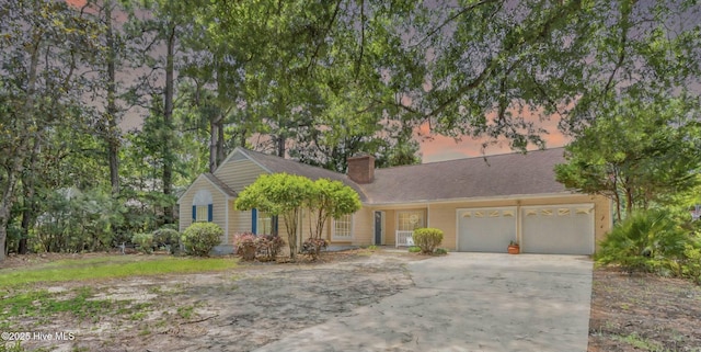 320 Embassy Cir, Wilmington, NC 28412 - single story home featuring a garage, a chimney, and driveway