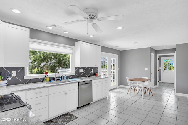 320 Embassy Cir, Wilmington, NC 28412 - kitchen with dishwasher, recessed lighting, tasteful backsplash, light tile patterned floors, and french doors