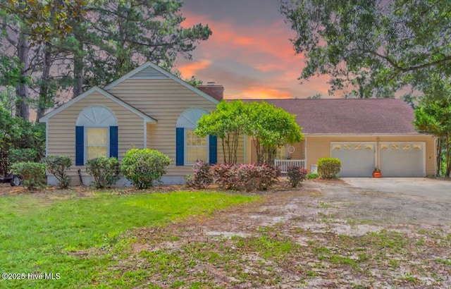 320 Embassy Cir, Wilmington, NC 28412 - ranch-style home with a garage, concrete driveway, a lawn, and a chimney